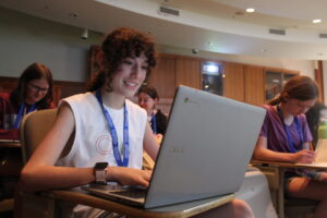 girl in class with laptop