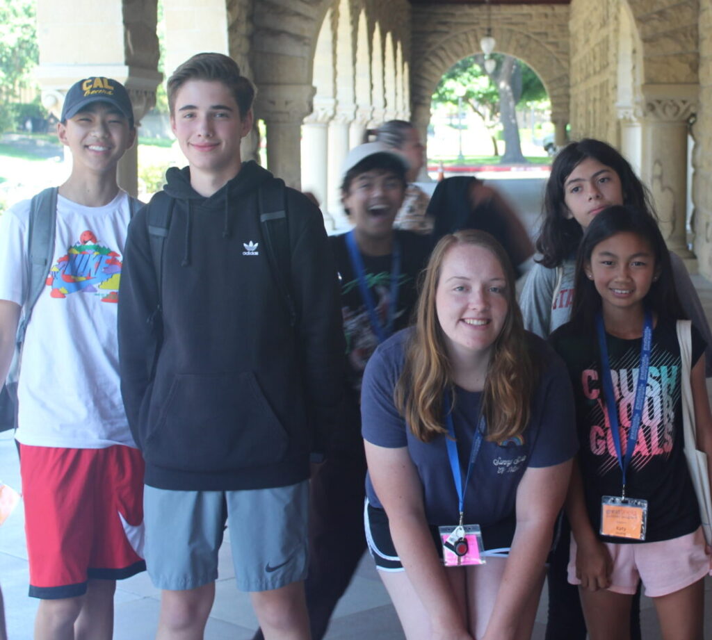 stanford group of boys and girls under stone arches