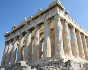 Visiting the Parthenon. Blue sky above. Teen travel program.